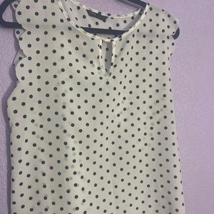 Sleeveless polka dot blouse